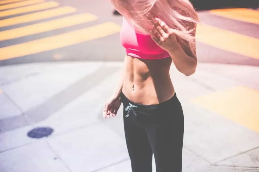 Woman with toned stomach after LA-EMS Body Sculpting Treatment Hamilton